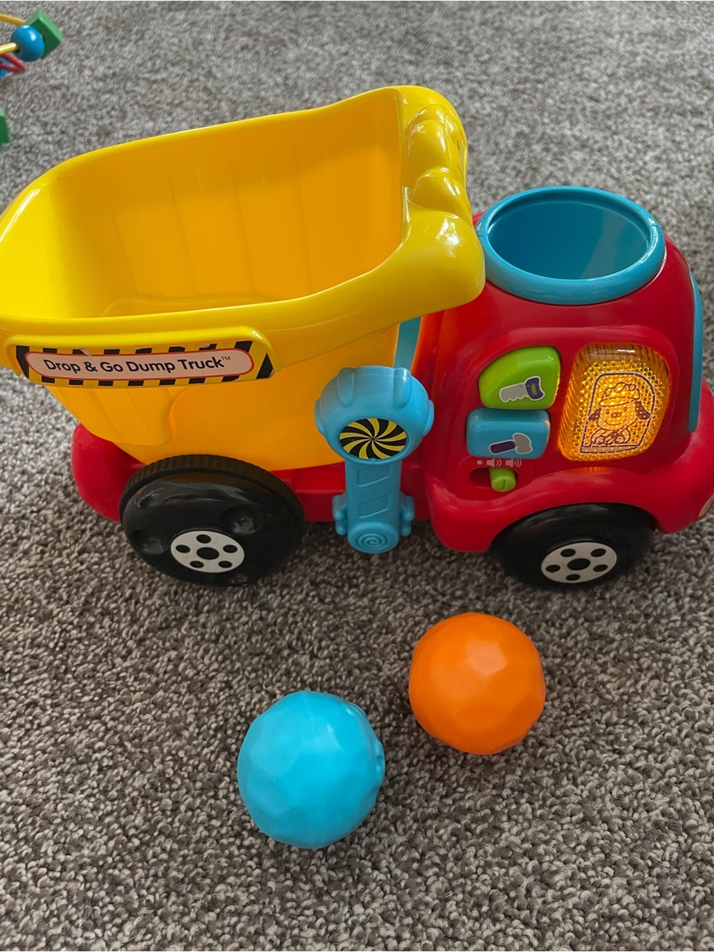 Interactive Drop & Go Dump Truck Toy - Yellow, Red, Blue